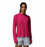 a women wearing a pink PFG Tidal Tee II Hoodie