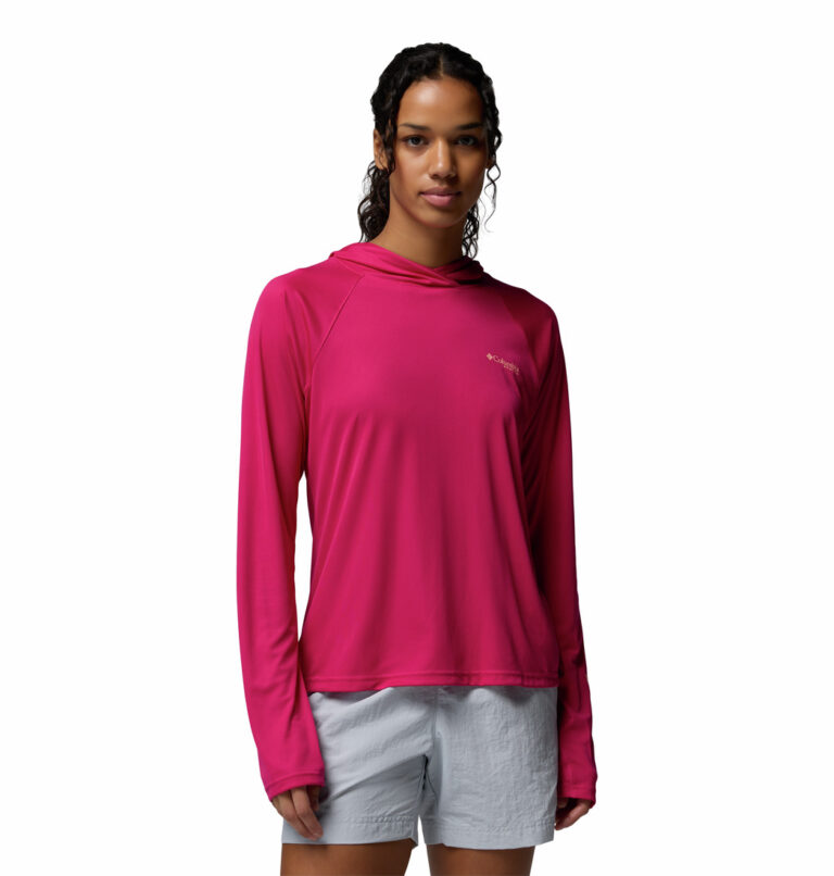 a women wearing a pink PFG Tidal Tee II Hoodie