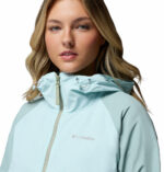 a women wearing a blue brown Spire Valley Windbreaker