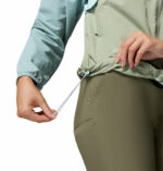 a women wearing a blue brown Spire Valley Windbreaker