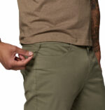a man wearing green ROC 5 Pocket Pants