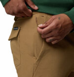 a man wearing brown ROC Tech Cargo Pants
