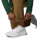 a man wearing brown ROC Tech Cargo Pants