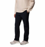 a man wearing a black ROC Tech Chino Pants
