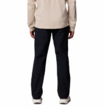 a man wearing a black ROC Tech Chino Pants