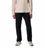 a man wearing a black ROC Tech Chino Pants