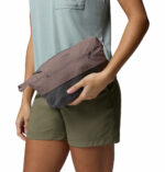 a women wearing a grey Trailborne 2.5L Shell Jacket