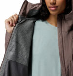 a women wearing a grey Trailborne 2.5L Shell Jacket