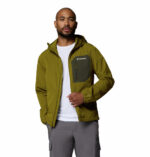 a man wearing a green Tall Heights III Softshell Jacket