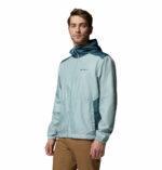 a man wearing a blue Discovery Loop Windbreaker
