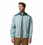 a man wearing a blue Discovery Loop Windbreaker