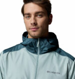 a man wearing a blue Discovery Loop Windbreaker