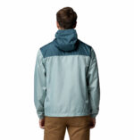a man wearing a blue Discovery Loop Windbreaker