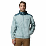 a man wearing a blue Discovery Loop Windbreaker