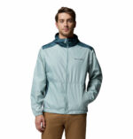 a man wearing a blue Discovery Loop Windbreaker