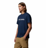 a man wearing a blue CSC Basic Logo Short Sleeve Tee