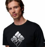 a man wearing a black CSC Seasonal Graphic Tee
