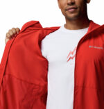 a man wearing a orange Trailborne Jacket