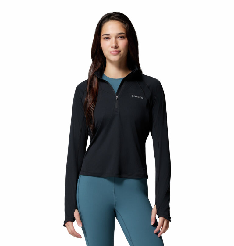 a women wearing a black Stealth Spring Half Zip Long Sleeve Tee