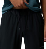 a man wearing a black Stealth Spring Pants