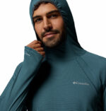 a man wearing a blue Stealth Spring Hoodie