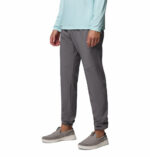 a man wearing a grey PFG Terminal Roamer Stretch Pants