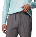 a man wearing a grey PFG Terminal Roamer Stretch Pants