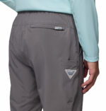 a man wearing a grey PFG Terminal Roamer Stretch Pants