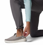a man wearing a grey PFG Terminal Roamer Stretch Pants