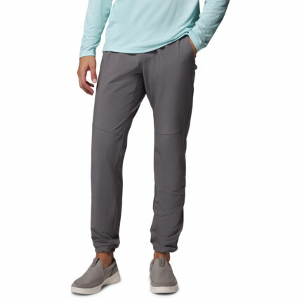 a man wearing a grey PFG Terminal Roamer Stretch Pants