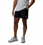a man wearing a Terminal Roamer Stretch Shorts