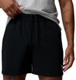 a man wearing a Terminal Roamer Stretch Shorts