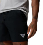 a man wearing a Terminal Roamer Stretch Shorts