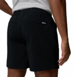a man wearing a Terminal Roamer Stretch Shorts