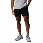 a man wearing a Terminal Roamer Stretch Shorts