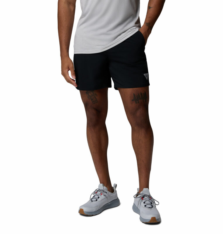 a man wearing a Terminal Roamer Stretch Shorts