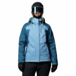a women wearing a blue Snowy Summit Insulated Jacket