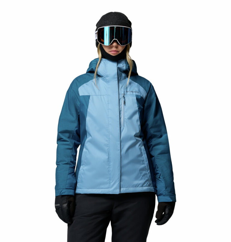 a women wearing a blue Snowy Summit Insulated Jacket