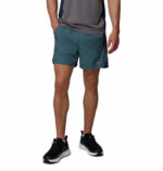 a man wearing a blue three pitch shorts