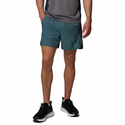 a man wearing a blue three pitch shorts