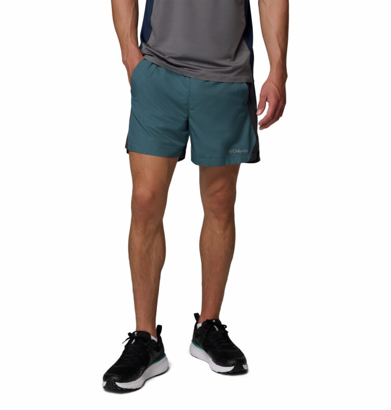 a man wearing a blue three pitch shorts