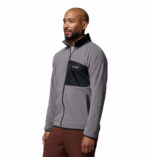 a man wearing a Fast Trek Overlay Full Zip Fleece Jacket