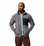 a man wearing a Fast Trek Overlay Full Zip Fleece Jacket