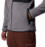 a man wearing a Fast Trek Overlay Full Zip Fleece Jacket