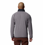a man wearing a Fast Trek Overlay Full Zip Fleece Jacket