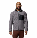 a man wearing a Fast Trek Overlay Full Zip Fleece Jacket