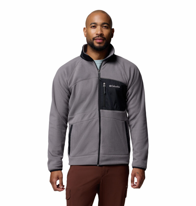 a man wearing a Fast Trek Overlay Full Zip Fleece Jacket