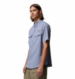 a man wearing a purple Skiff Guide II Short Sleeve Shirt