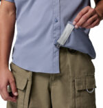 a man wearing a purple Skiff Guide II Short Sleeve Shirt