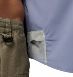 a man wearing a purple Skiff Guide II Short Sleeve Shirt